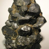 Z jakého materiálu Marie Curie izolovala Radium a Polonium?